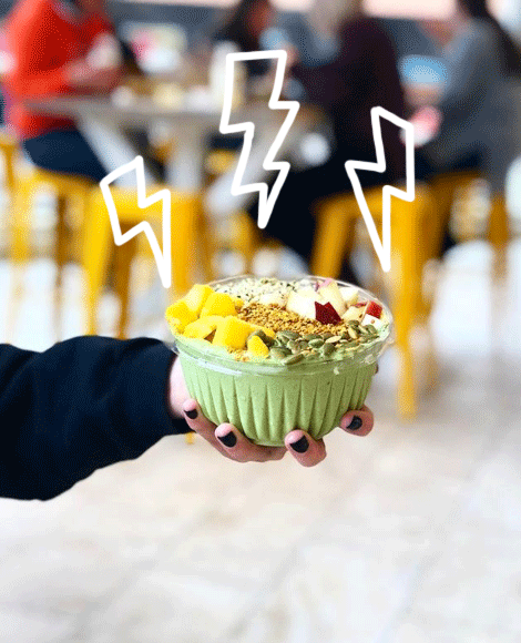 A smoothie bowl with lightning bolts dancing around it